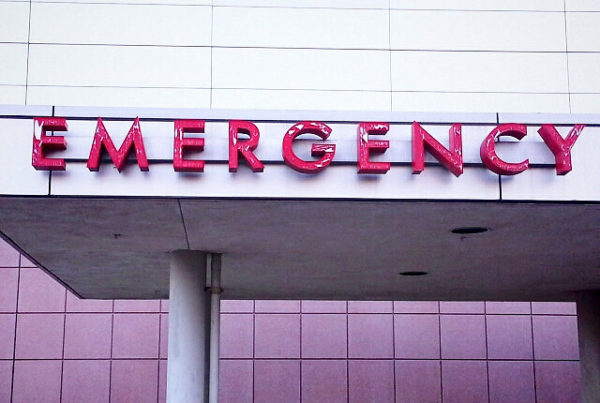 Signage on a building that says Emergency