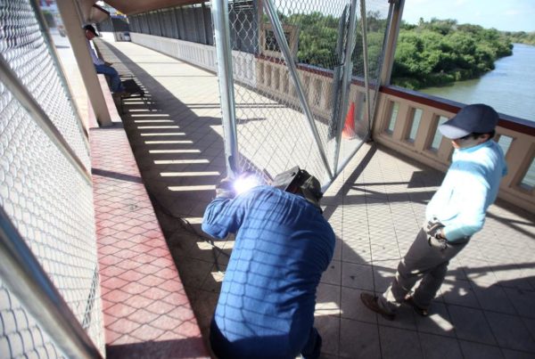 In Preparation For Migrant Caravan, Temporary Fencing Goes Up On Progreso International Bridge
