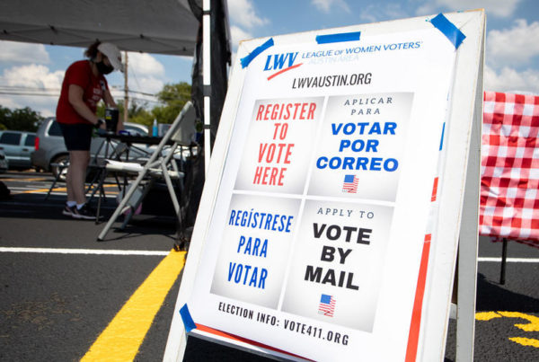 A table is set up outside Juan Navarro Early College High School last month with information on how to register to vote.