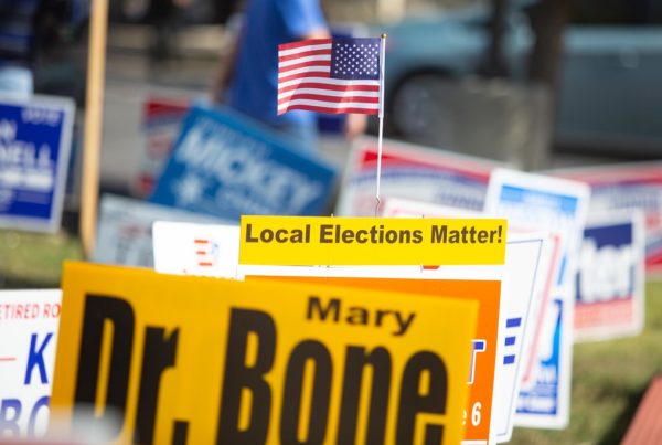 political signs at a polling place on Election Day