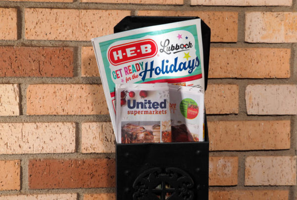 H-E-B and United Supermarkets coupon mailers in a mailbox