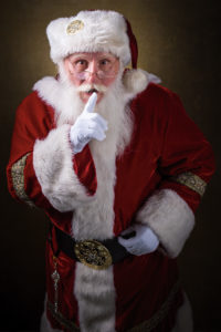 a man dressed in a red and white Santa costume