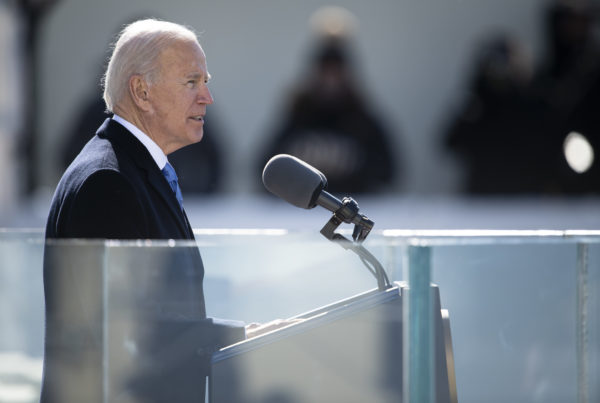 President Biden speaking at a lectern during his inauguration
