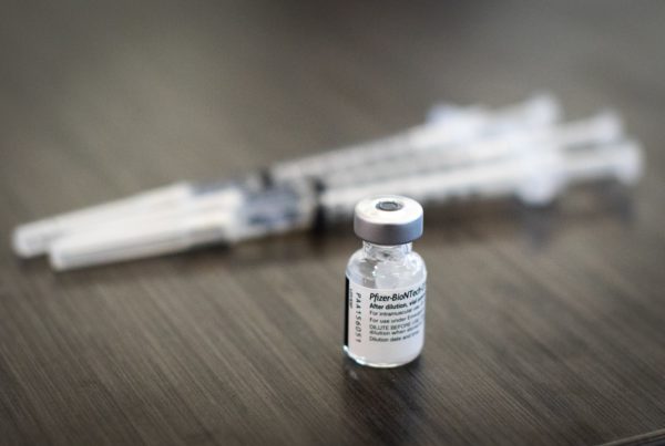 A vial of the Pfizer COVID-19 vaccine provided to health care workers at Dell Medical School.