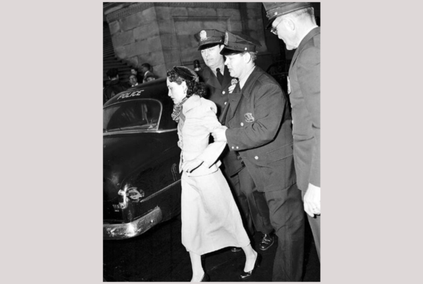 Puerto Rican nationalist Lolita Lebrón being led by police into a police care in 1954