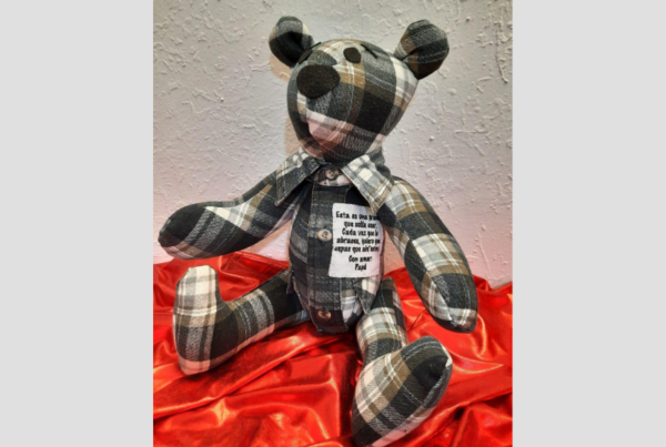 a teddy bear made with a plaid shirt