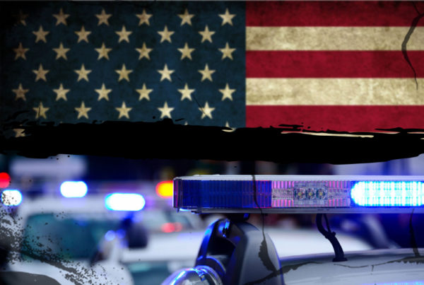 an illustration of an American flag and police car lights