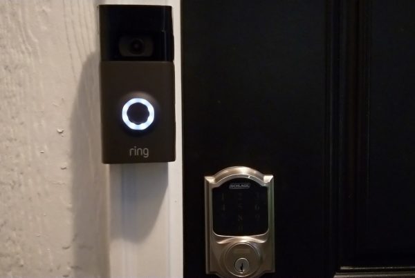 A ring doorbell mounted near a door