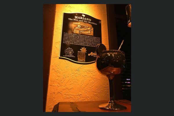 a plaque with a fake margarita glass in front of it