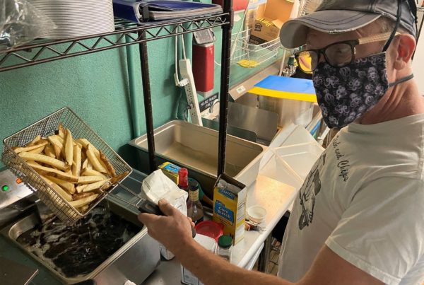 a man frying french fries