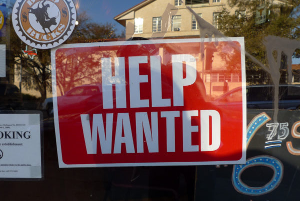 help wanted sign on a window