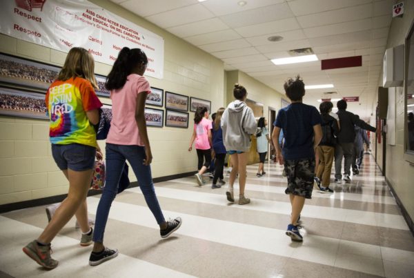students walking in a school hallway
