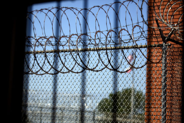 razor wire atop a wall at a prison