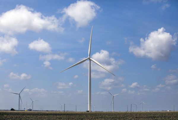 a wind turbine with several others in the background