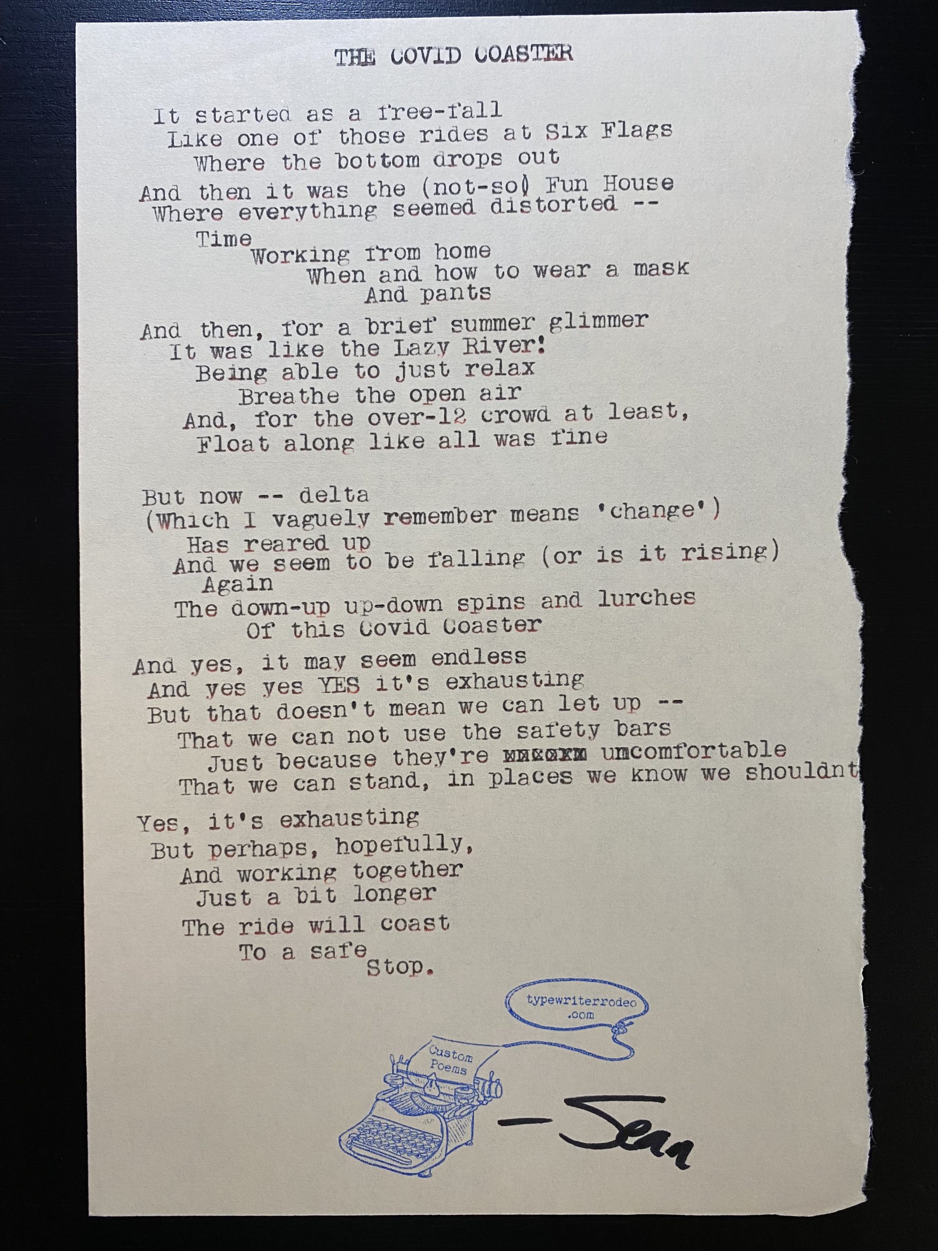 a photo of the typewritten poem on a torn piece of paper
