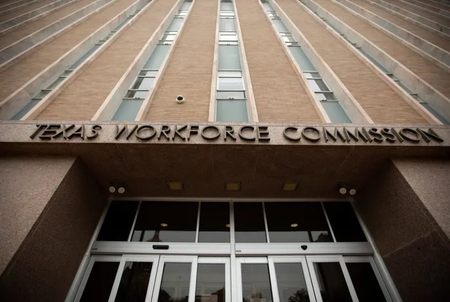 a view looking up at the Texas Workforce Commission building
