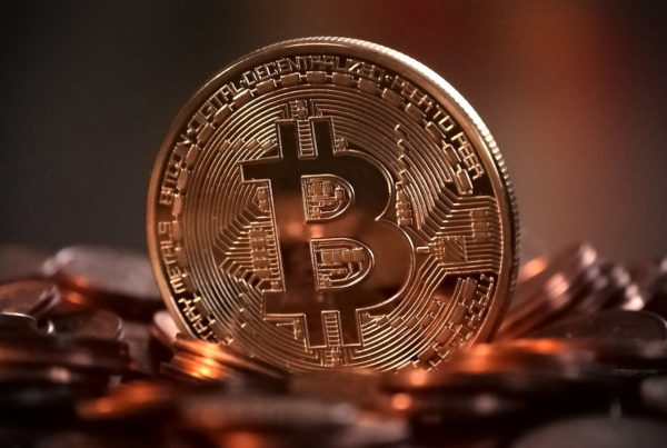 a large coin with a bitcoin logo