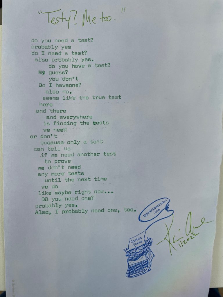 a photo of the typewritten poem on a torn piece of purple paper