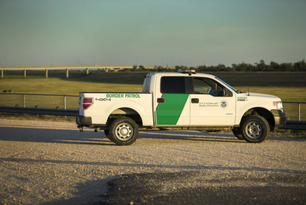 a white border patrol truck, viewed from several feet away