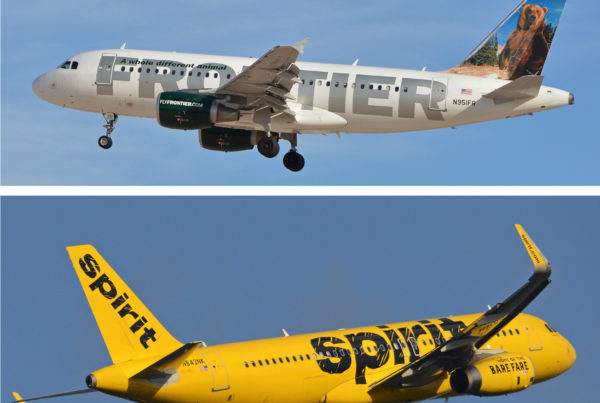 a white frontier airlines plane with sivler writing that says frontier on the plane, and a yellow spirit airlines plane in yellow with the word spirit in black on the plane