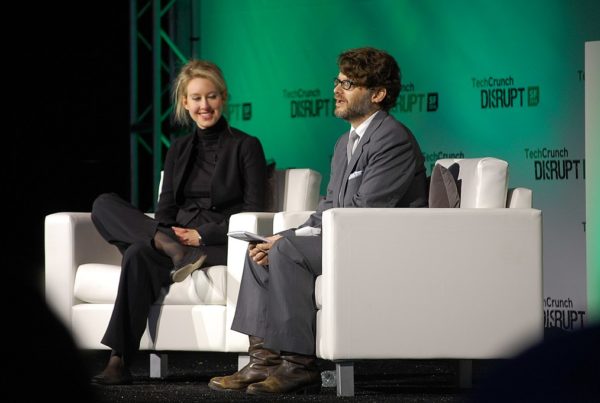 Elizabeth Holmes sits with an interviewer on stage at a 2014 tech conference.