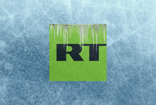 A frozen background with large icicles, and the initials RT in the foreground