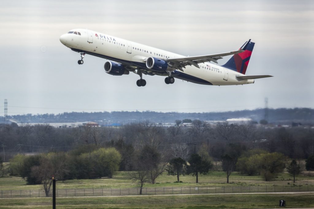 A Delta Air Lines flight departs from Austin-Bergstrom International Airport