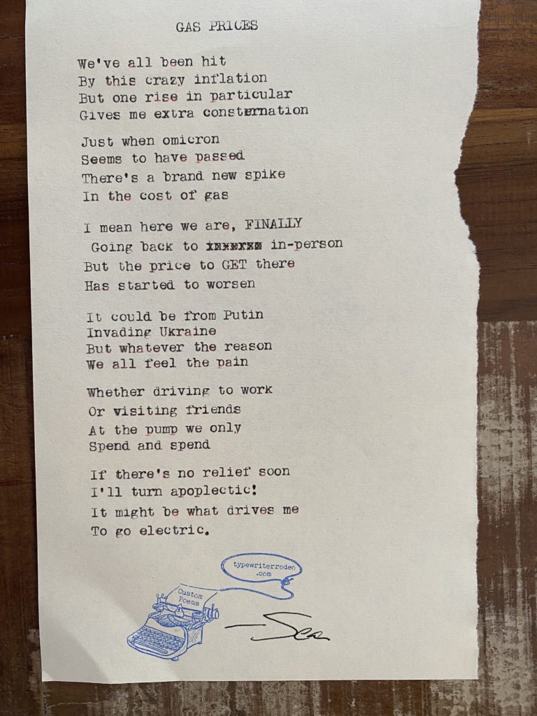 a photo of the typewritten poem on a torn piece of paper