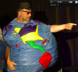 Lanny Smith wears a round earth costume with his head and arms sticking out