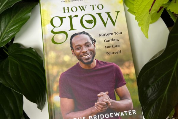 "How to Grow" book cover with a pcutre of the author, a smiling man with hands clasped in front of him