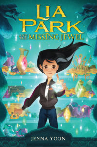 The cover image of "Lia Park and the Missing Jewel" shows a young woman with flowing black hair holding a sparking jewel in front of a background of shining treasures.