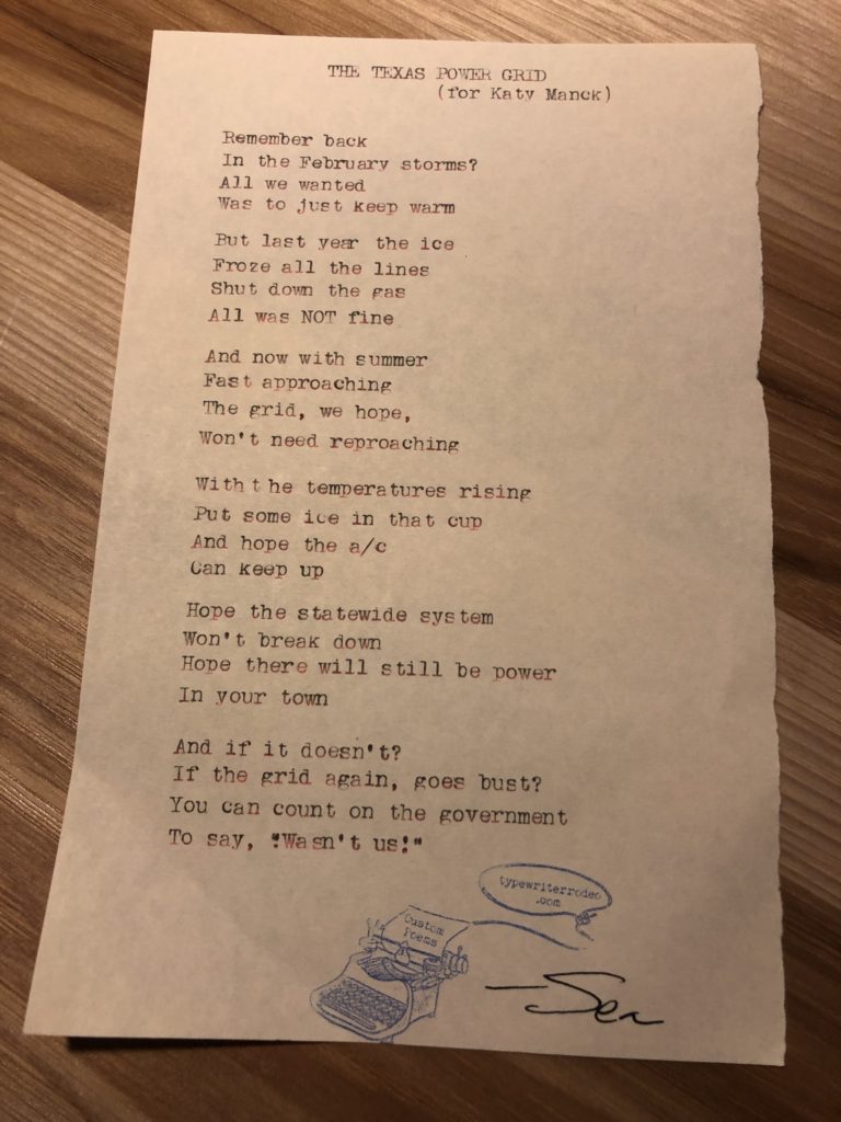 Photo of the typewritten poem on a torn half-sheet of paper.