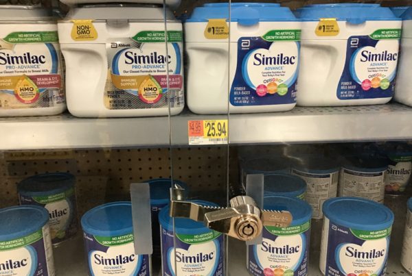 cans of baby formula in a locked case