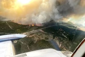 An aerial view of wildfire and smoke
