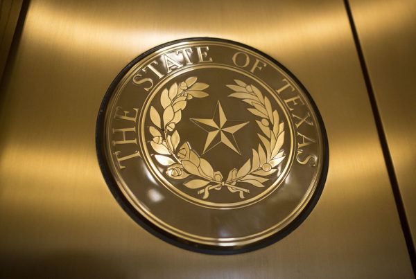 A close-up of the State of Texas seal