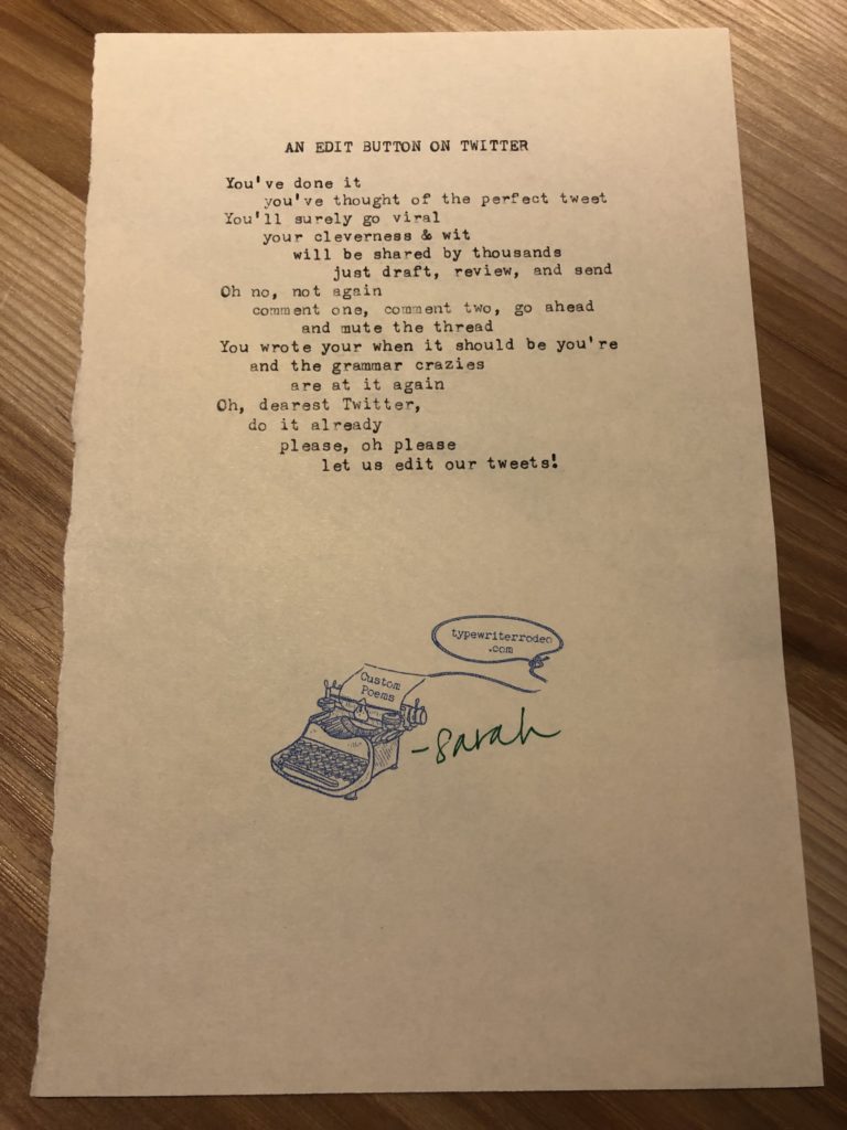 A photo of the typewritten poem on a torn half-sheet of yellow paper.
