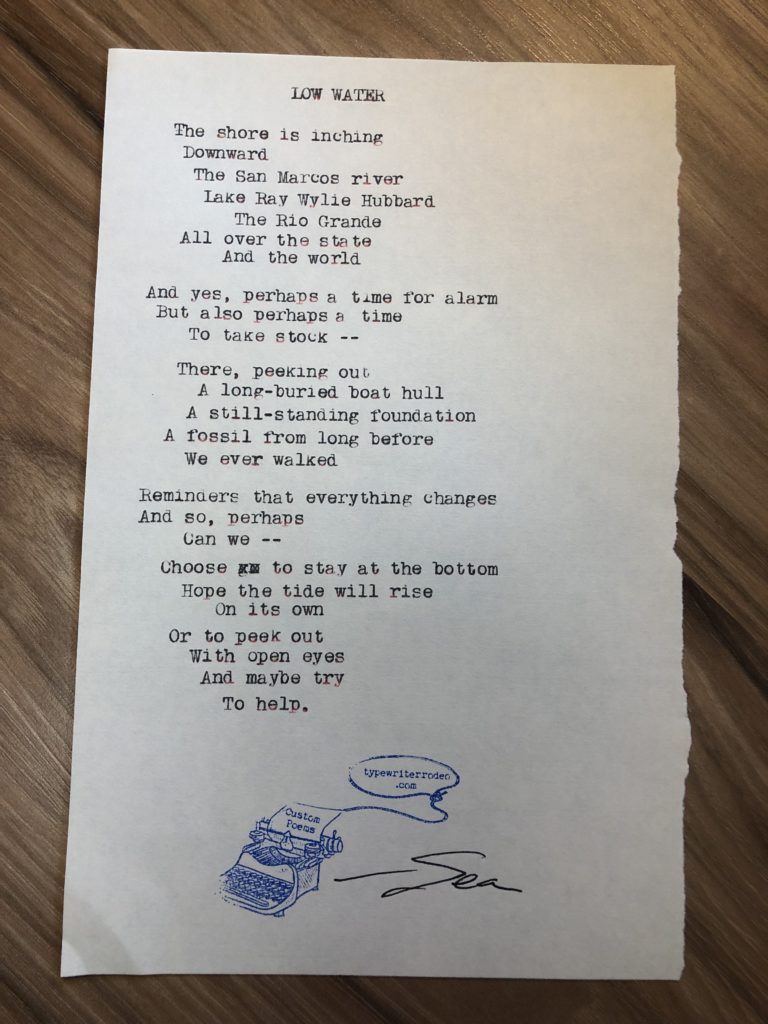 a photo of the typewritten poem on a torn half-sheet of paper.