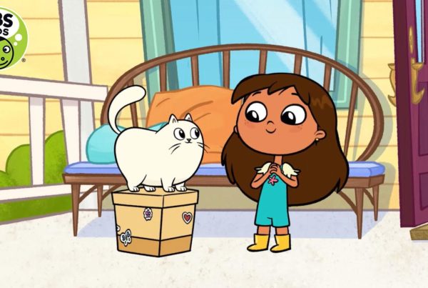 A screenshot of the new program "Rosie's Rules" shows a little girl wearing yellow rain boots smiling at a chubby white cat standing on a box.