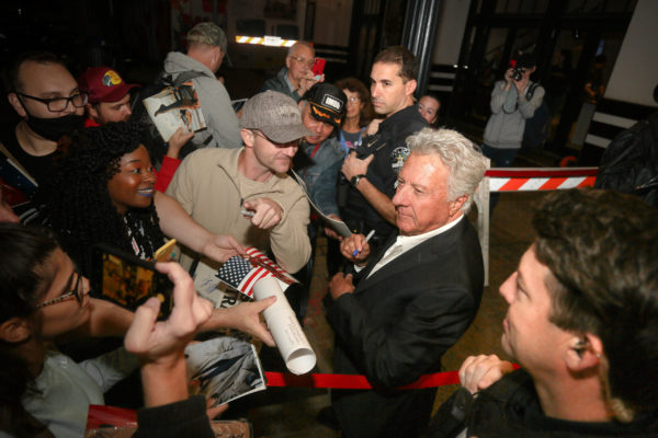 Dustin Hoffman signing autographs.