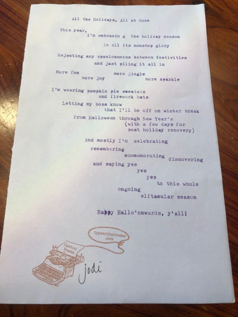 a photo of the typewritten poem on a torn half-sheet of light purple paper with a slight rainbow image on it