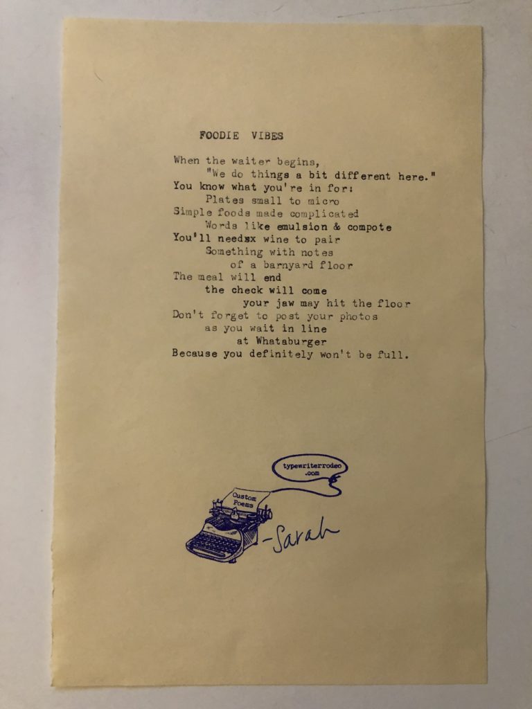 a photo of the typewritten poem on a torn half-sheet of a yellow paper.