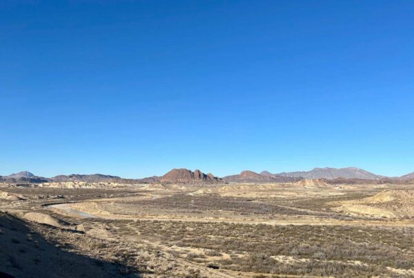 A wide view of view of Terlingua Creek under a big blue sky