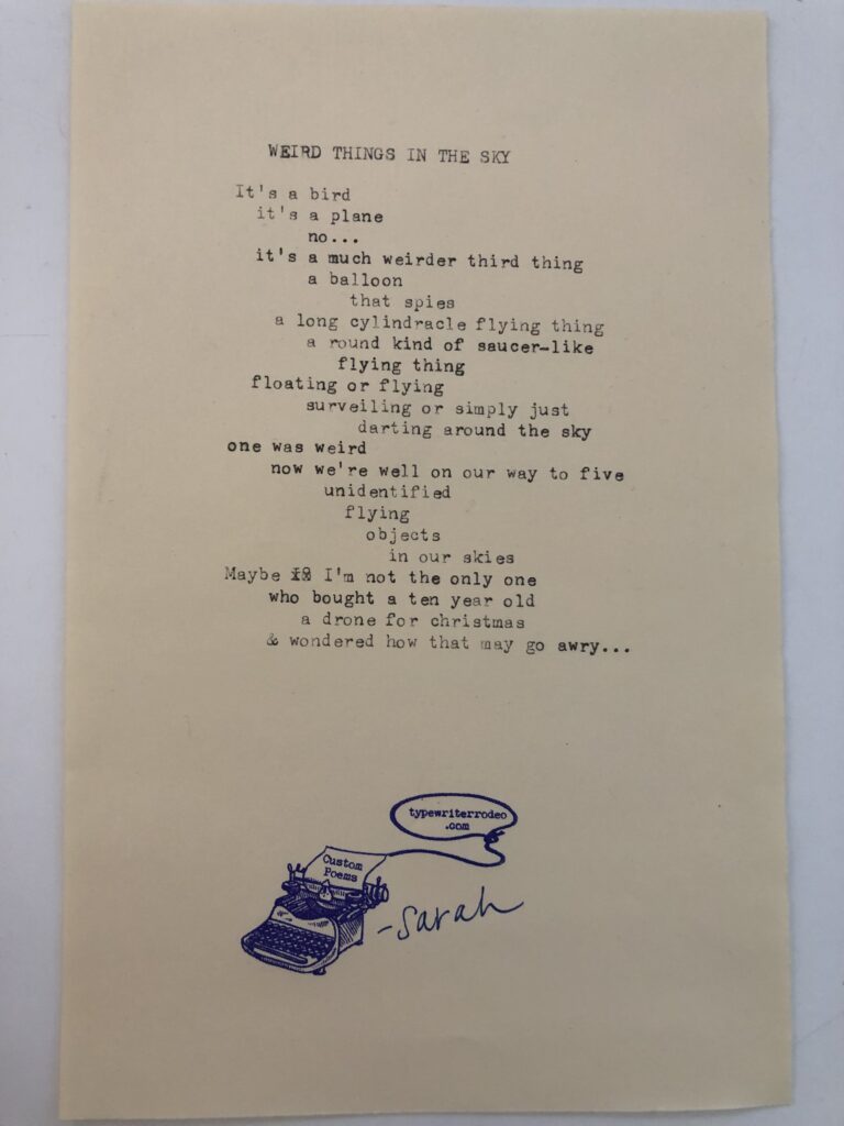 a photo of the typewritten poem on a torn half-sheet of light yellow paper