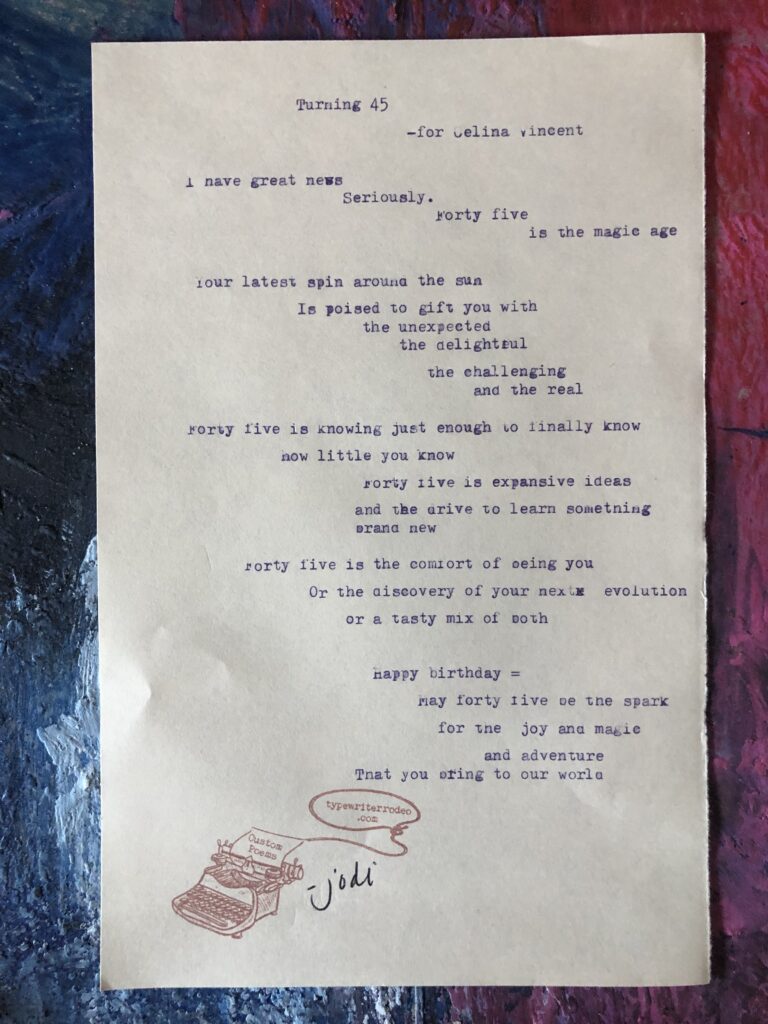 a photo of the typewritten poem on a torn half-sheet of light yellow paper