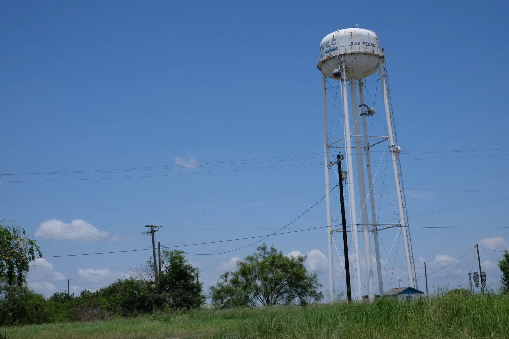 A water tower is seen.
