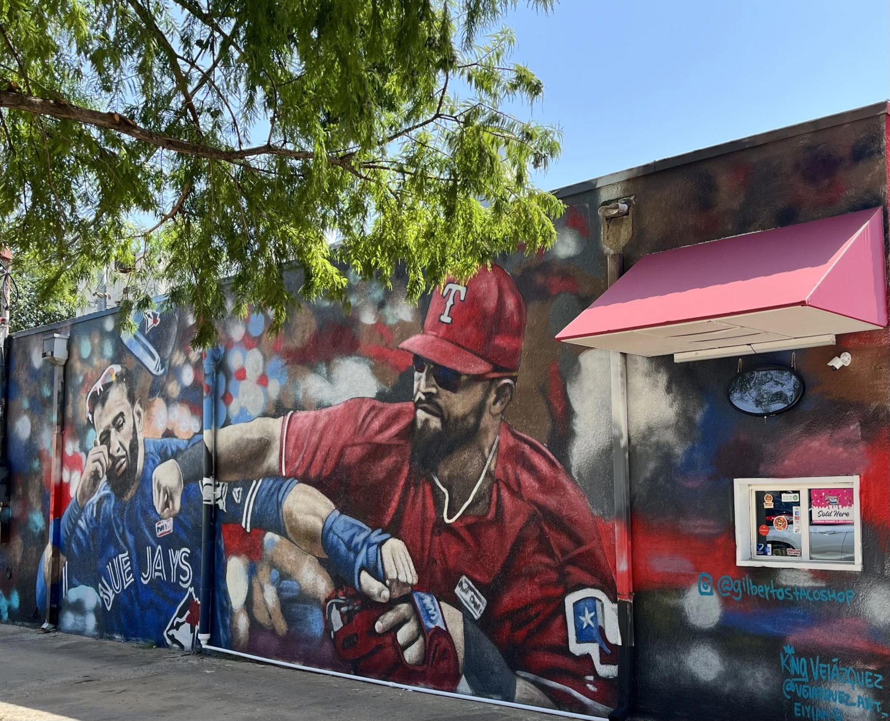 A mural depicts Texas Rangers infielder punching Toronto Blue Jays' José Bautista. The mural is inspired by a famous photograph of the incident.