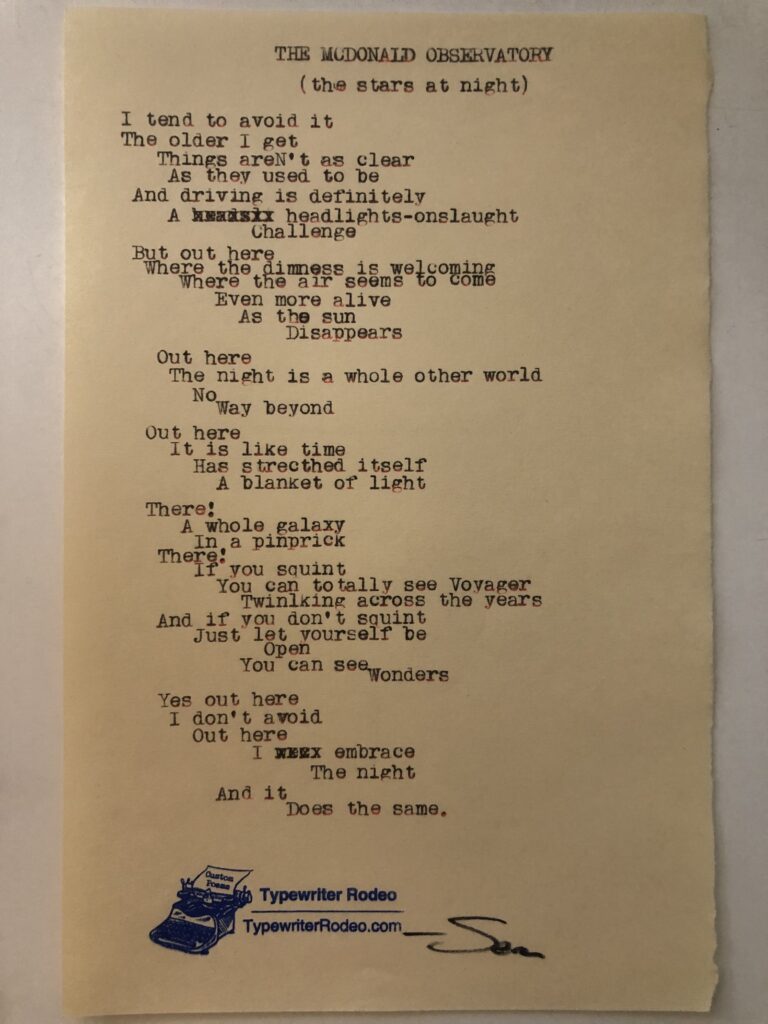 a photo of the typewritten poem on a torn piece of yellow paper