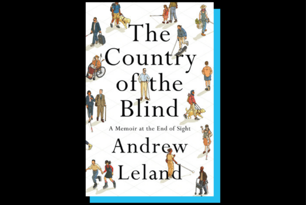 The book cover of "Country of the Blind" is seen. It's a white cover with the title and author name in the middle. Illustrations of individuals using walking sticks, wheelchairs, seeing-eye dogs, and black glasses intersperse in the background engaged in various activities – walking, rollerblading and conversing with each other.