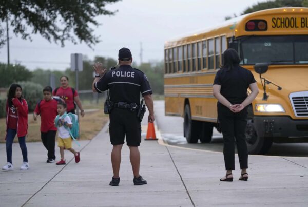 A new state law requires schools to have armed guards. But many are having a hard time hiring officers.