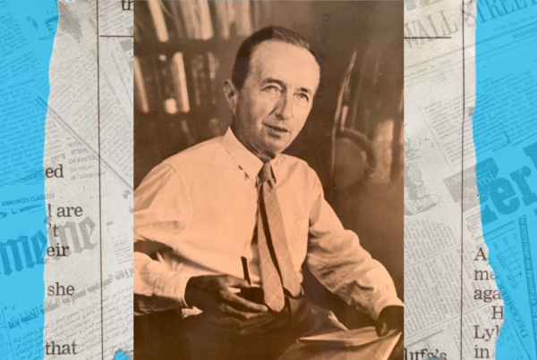 A sepia-toned photo shows a man in a tie and white buttoned-up shirt sitting with a pipe in one hand and a newspaper in the other. The photo is centered on a background featuring newspaper clippings.